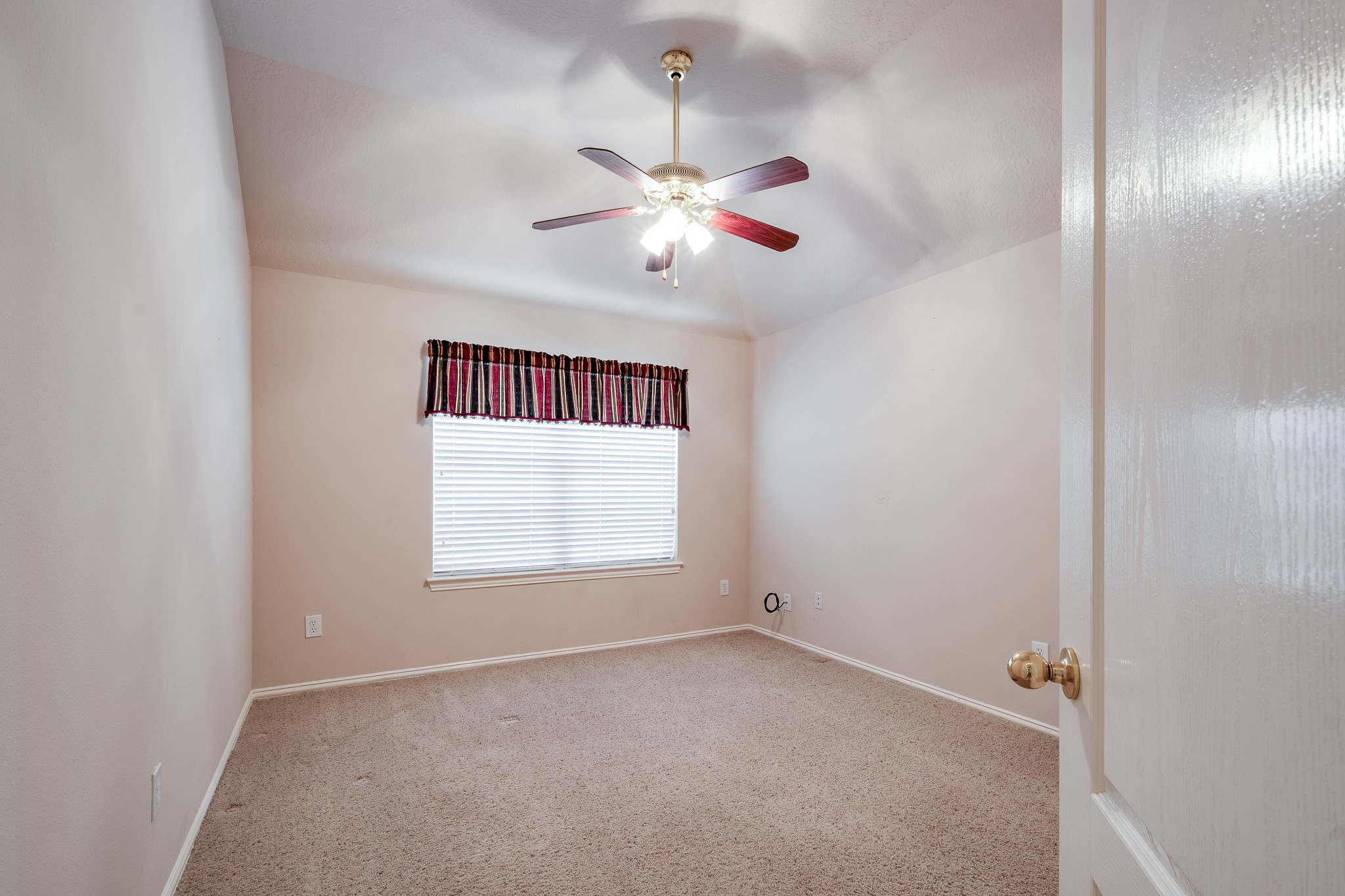 5914 Birdie Way Pasadena, TX 77505 - Photo 26 of 32 an empty room with a window and a fan