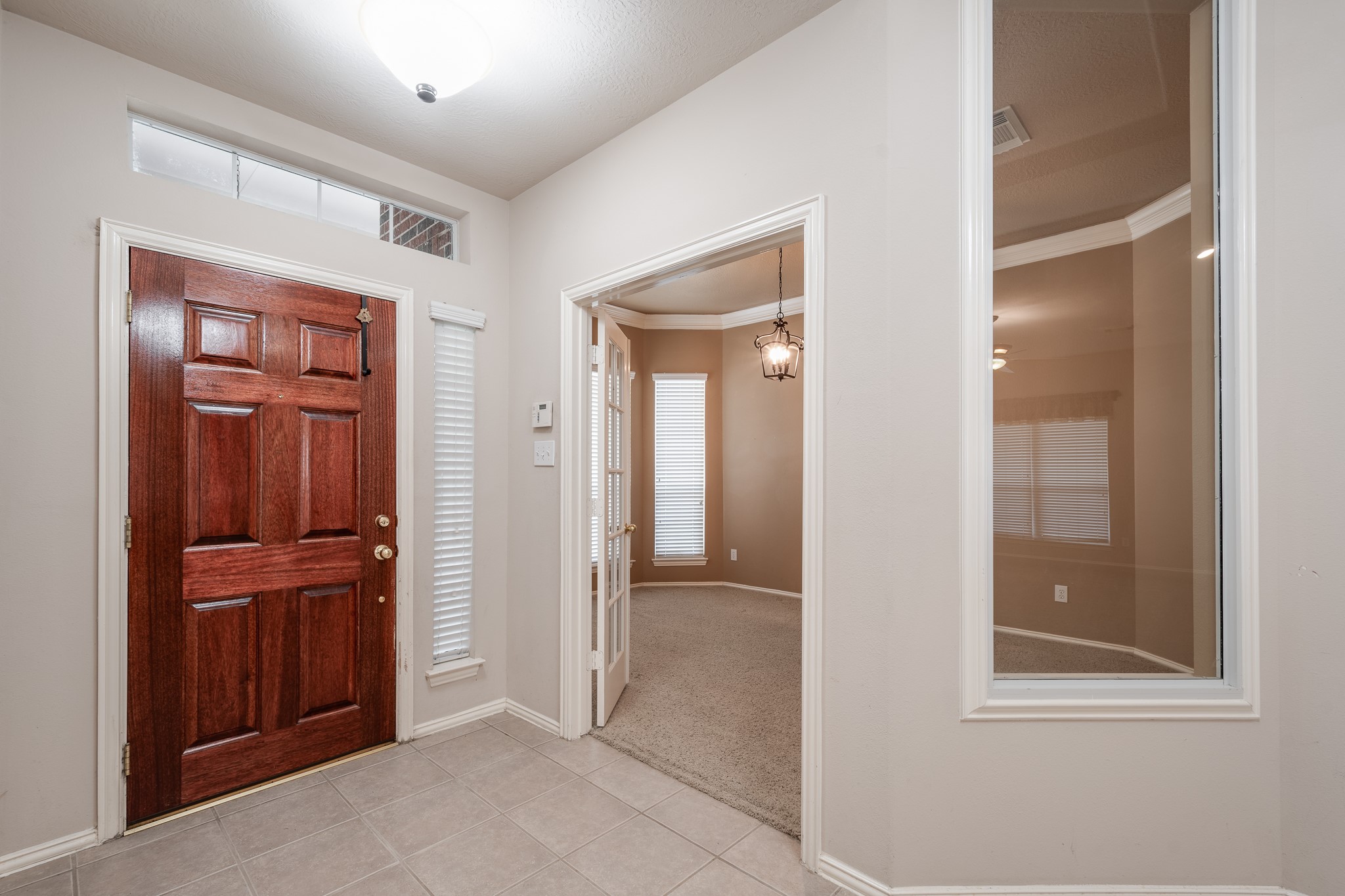 5914 Birdie Way Pasadena, TX 77505 - Photo 4 of 32 wooden floor and windows in a room