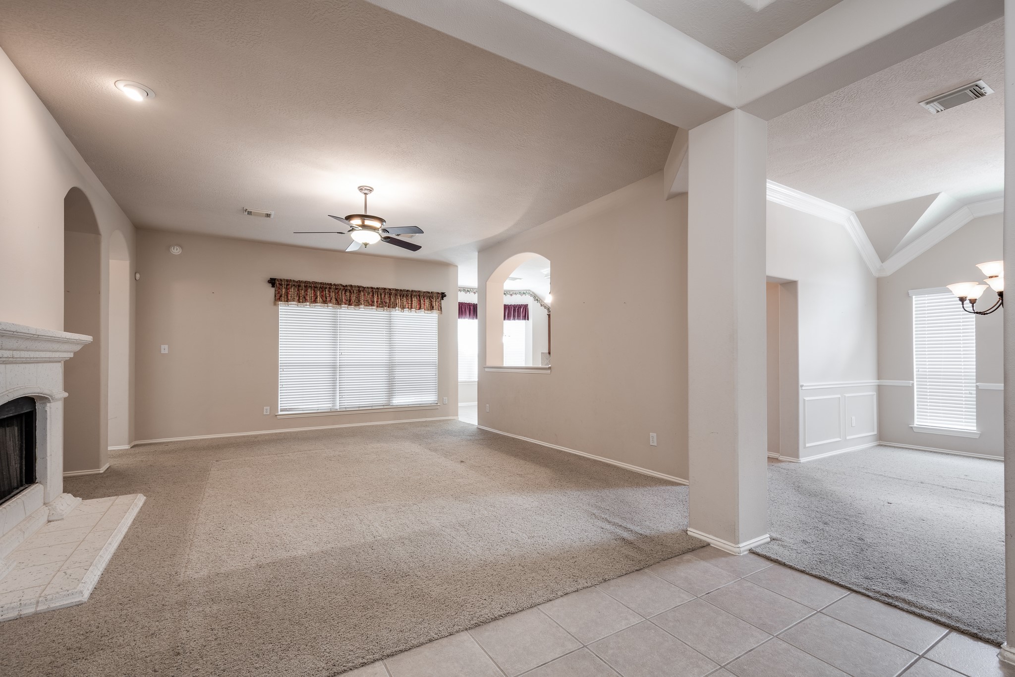 5914 Birdie Way Pasadena, TX 77505 - Photo 6 of 32 a view of an empty room with a fireplace and a window