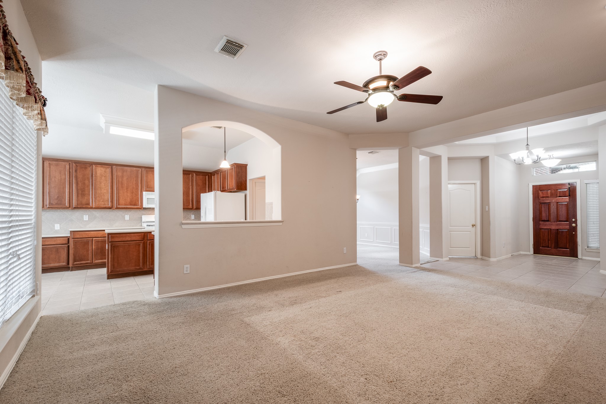 5914 Birdie Way Pasadena, TX 77505 - Photo 10 of 32 a view of an empty room with a kitchen