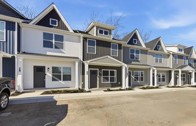 a view of a kitchen with a sink and a refrigerator