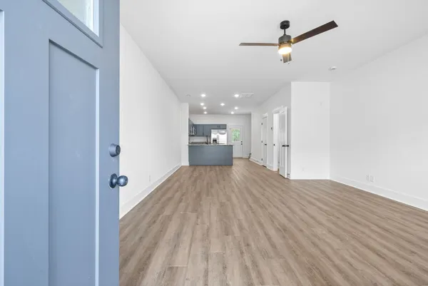 a large kitchen with granite countertop a sink a oven and a granite counter top