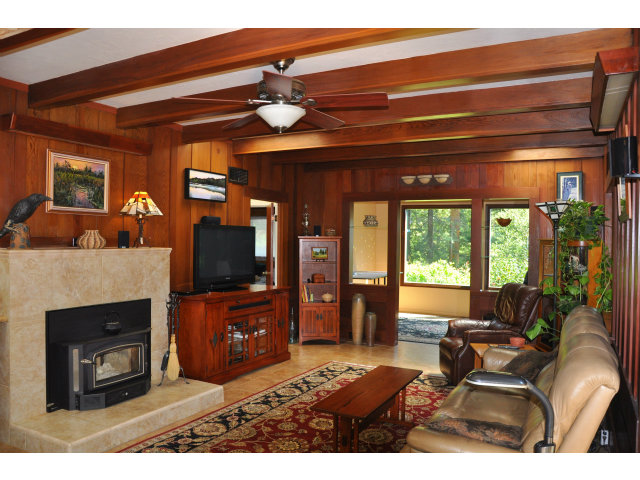 10250 Alba Road Ben Lomond, CA 95005 - Photo 2 of 12 a living room with furniture and a fireplace