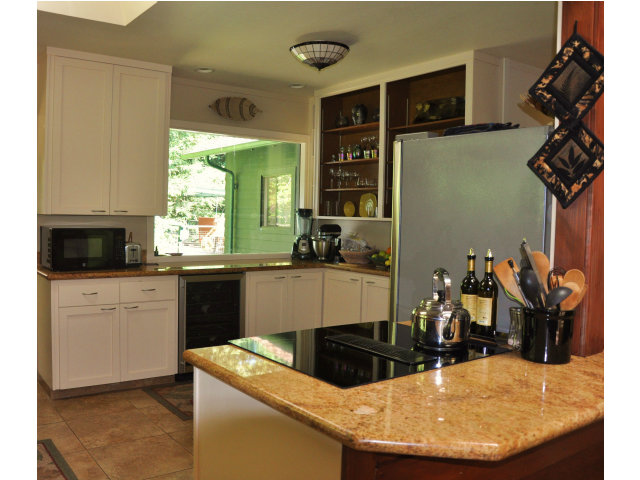 10250 Alba Road Ben Lomond, CA 95005 - Photo 3 of 12 a kitchen with granite countertop a sink a stove and cabinets
