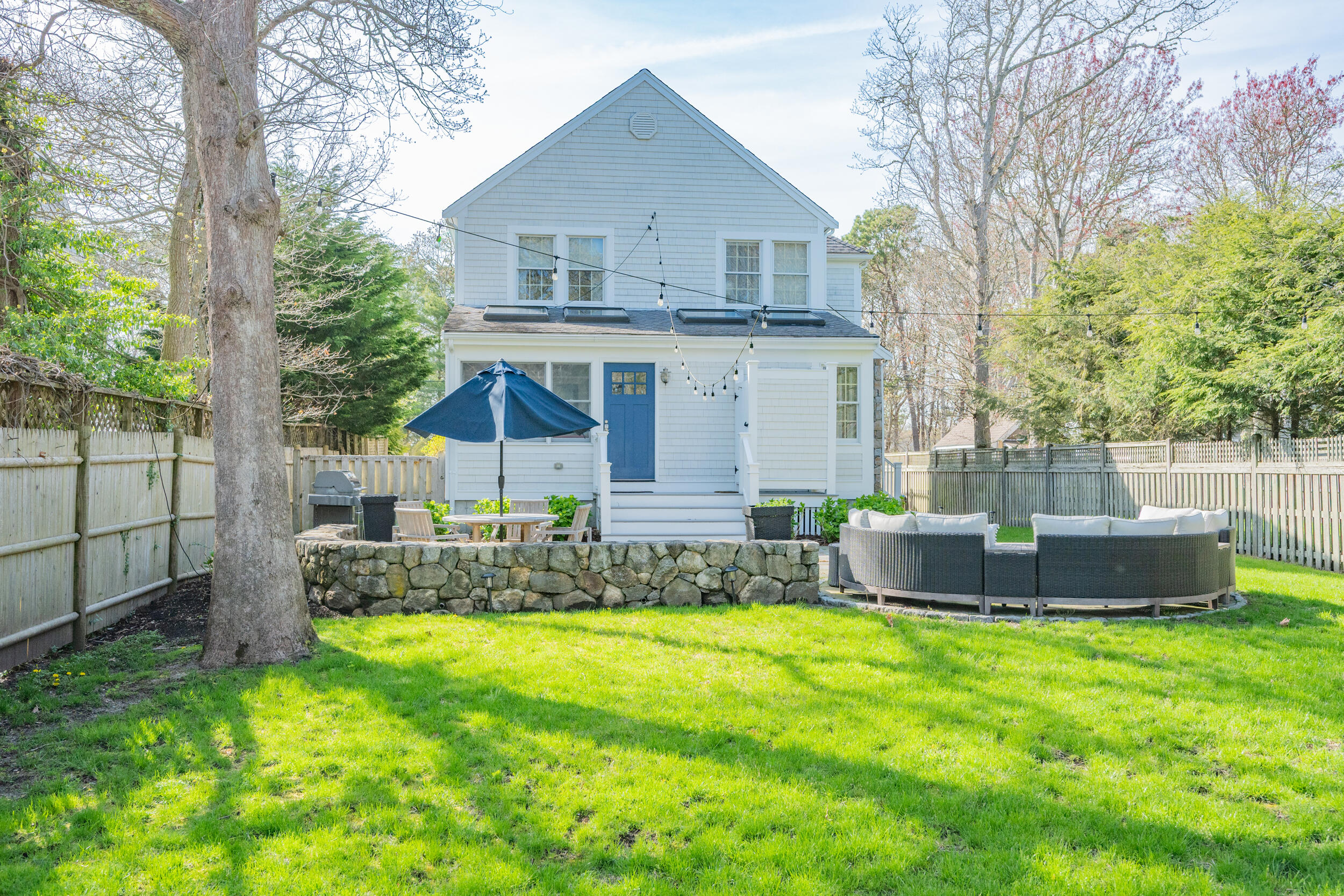 21 Bayview Road Mashpee, MA 02649 - Photo 3 of 85 a view of a house with a yard and sitting area