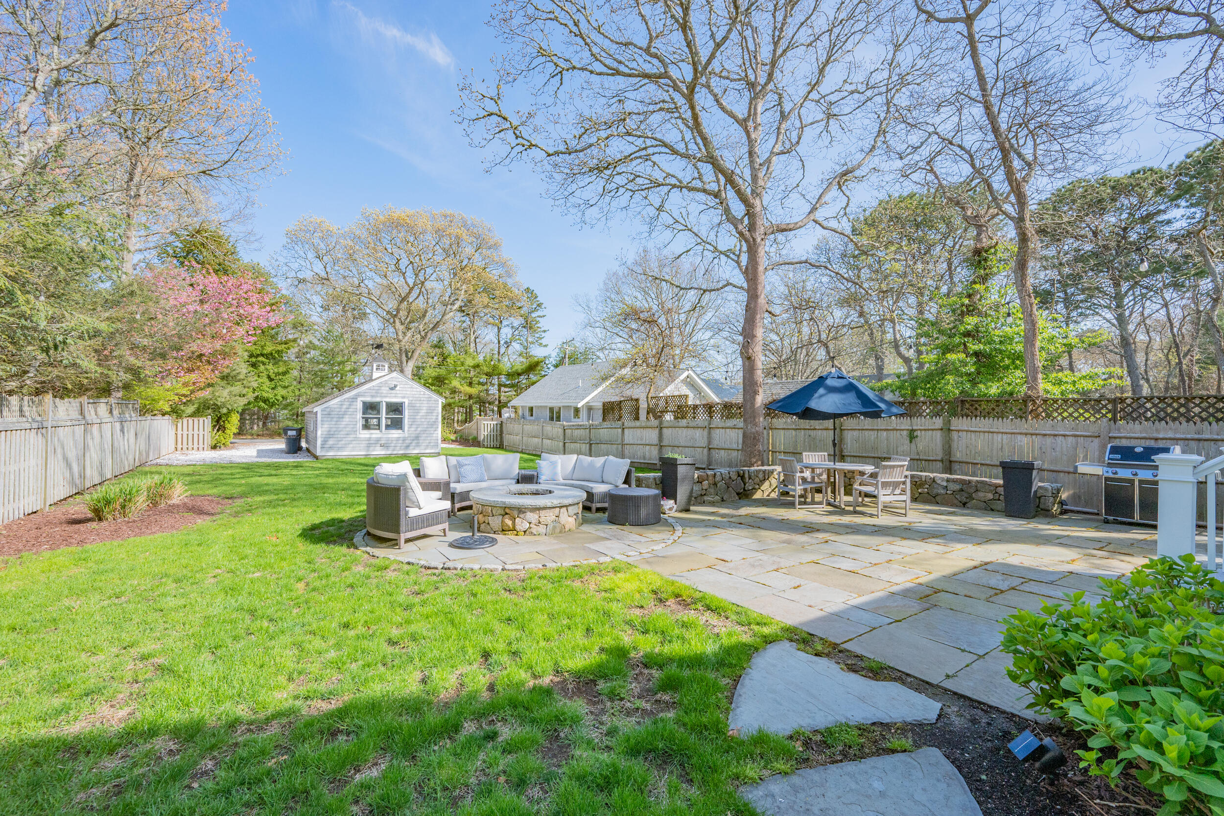 21 Bayview Road Mashpee, MA 02649 - Photo 4 of 85 a view of a house with swimming pool and sitting area