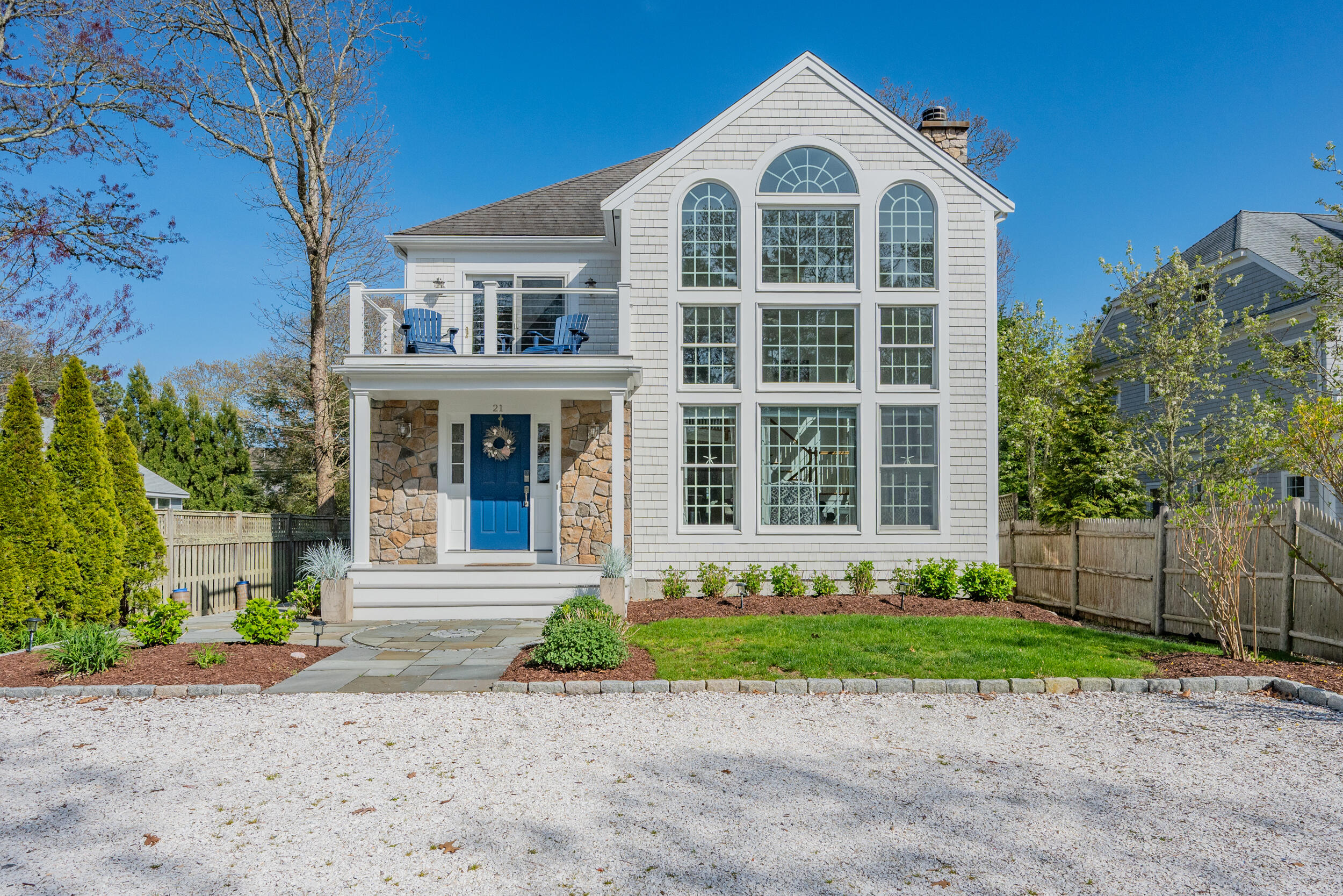 21 Bayview Road Mashpee, MA 02649 - Photo 54 of 85 a front view of a house with a garden