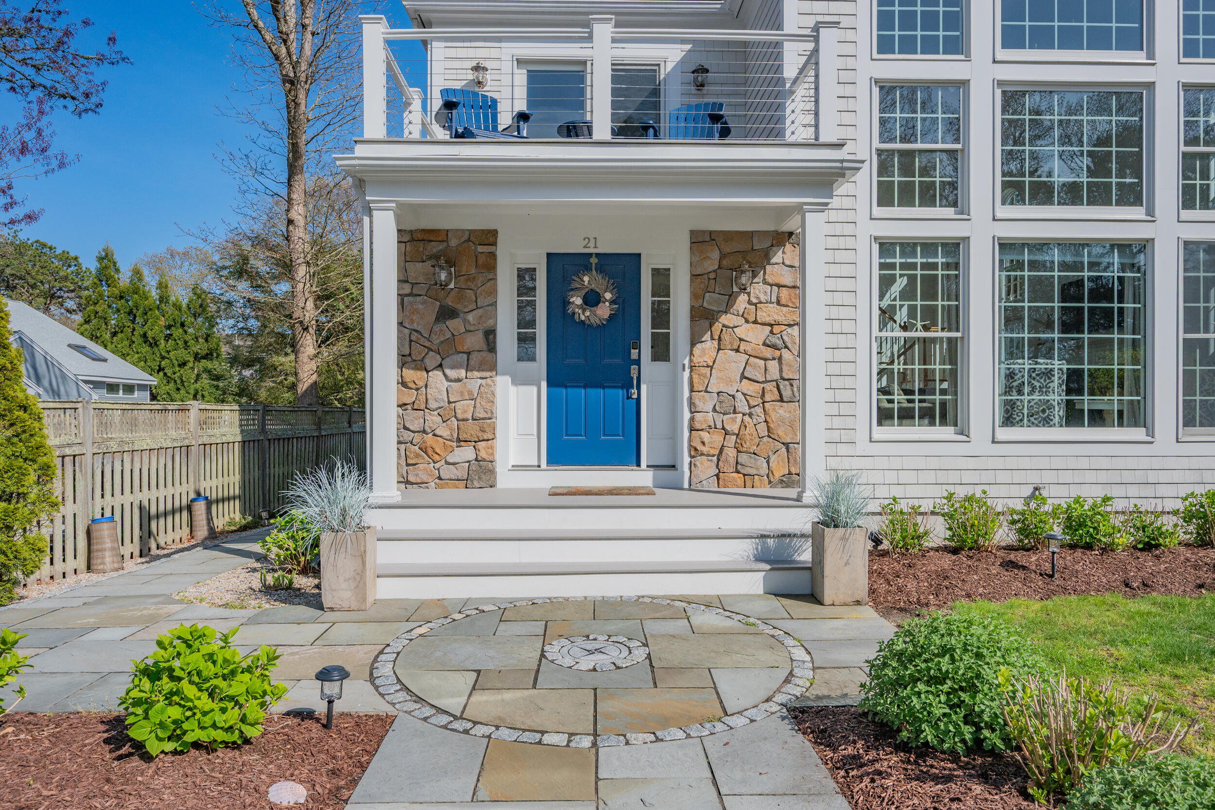 21 Bayview Road Mashpee, MA 02649 - Photo 56 of 85 a front view of a house with a garden