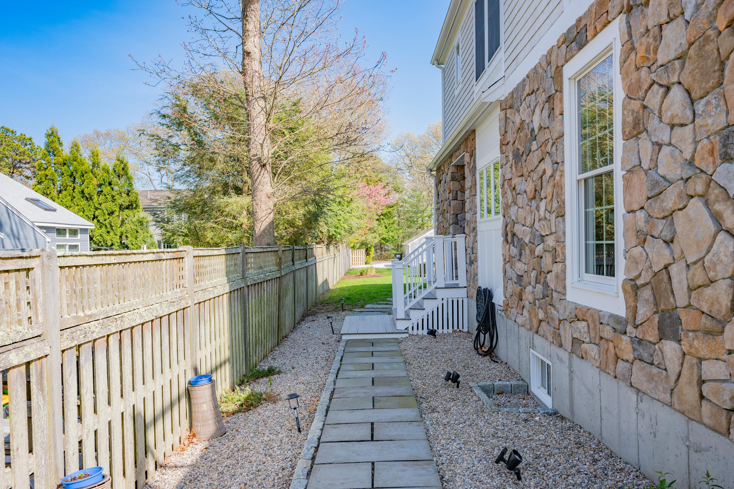 21 Bayview Road Mashpee, MA 02649 - Photo 58 of 85 a view of a pathway with a wrought fence