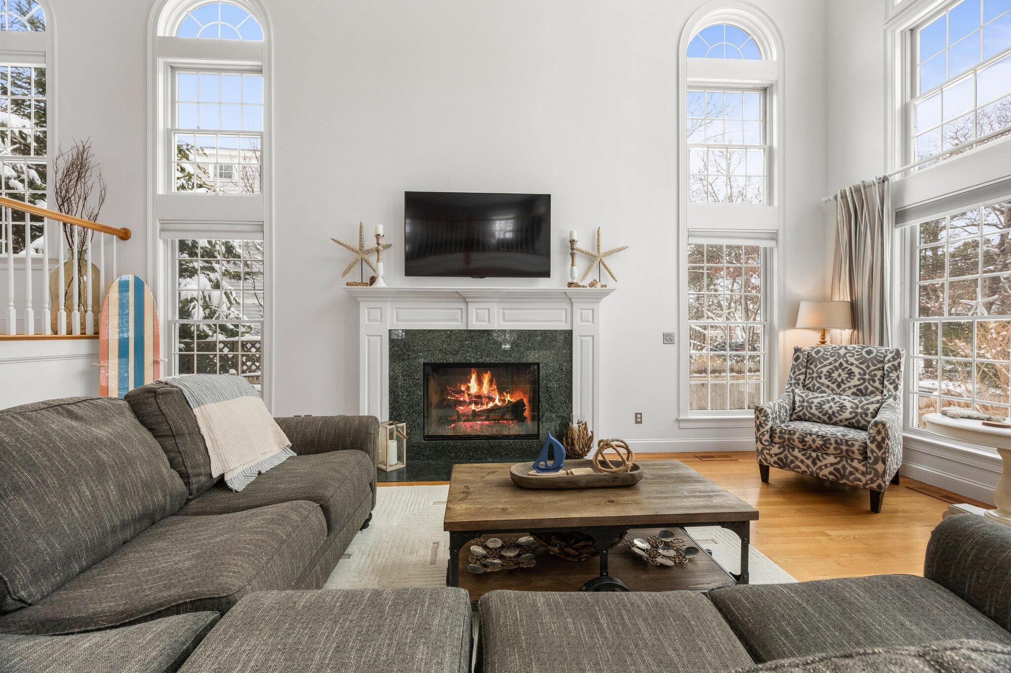 21 Bayview Road Mashpee, MA 02649 - Photo 9 of 85 a living room with furniture fireplace and window