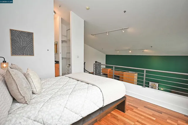 a bedroom with bed and balcony