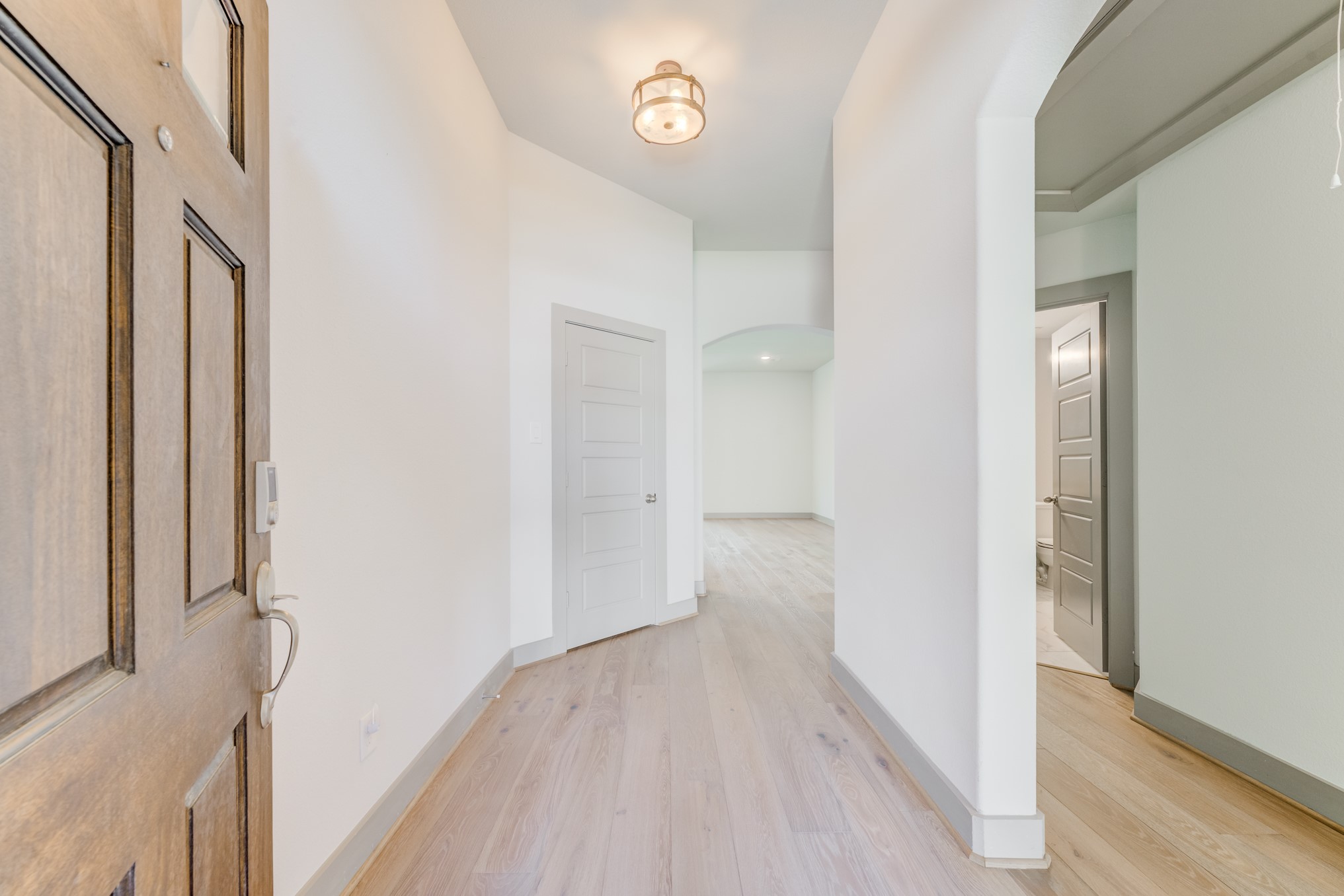 11913 Mockingbird Lane Montgomery, TX 77356 - Photo 5 of 19 a view of a hallway with wooden floor
