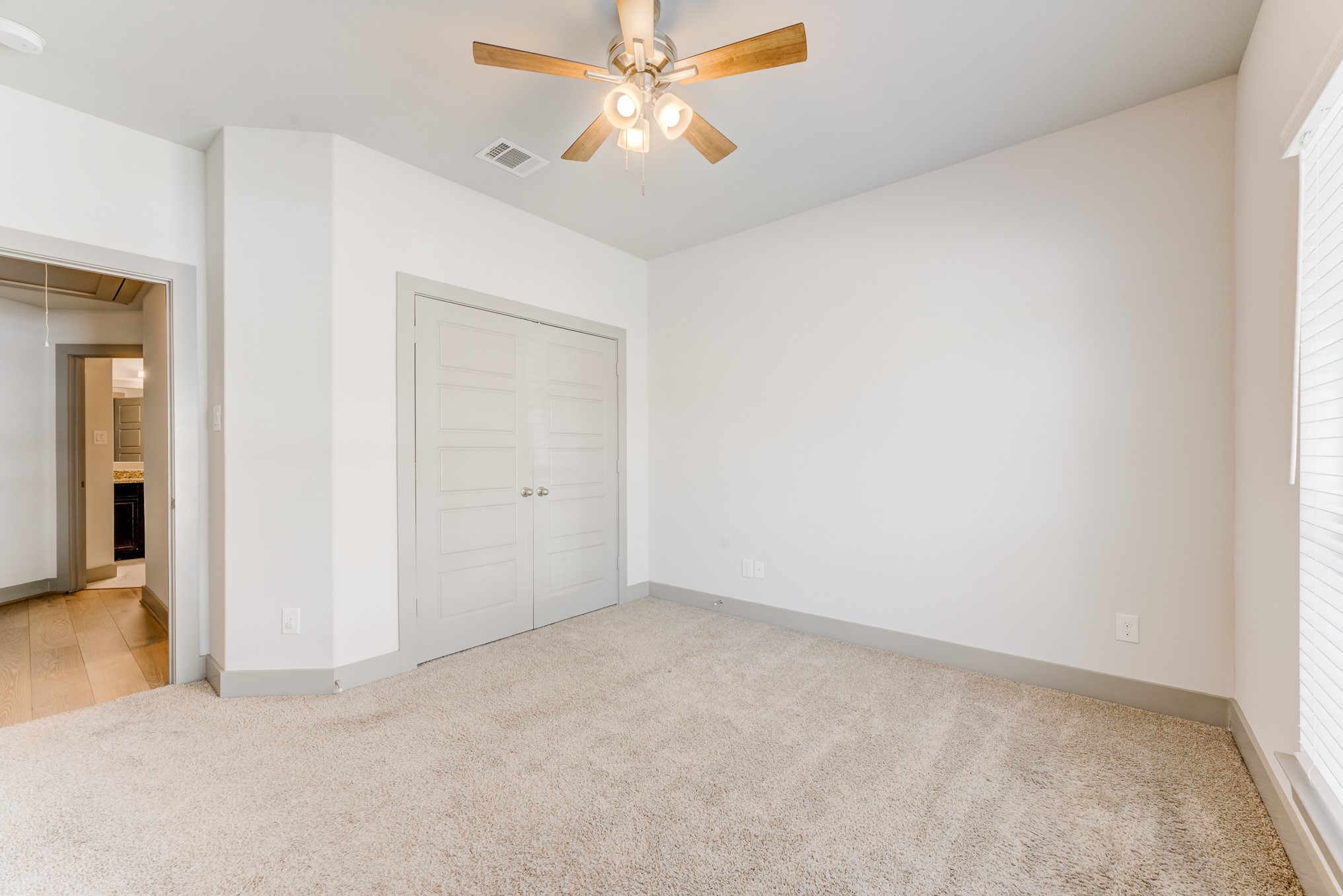 11913 Mockingbird Lane Montgomery, TX 77356 - Photo 6 of 19 an empty room with closet and a chandelier fan