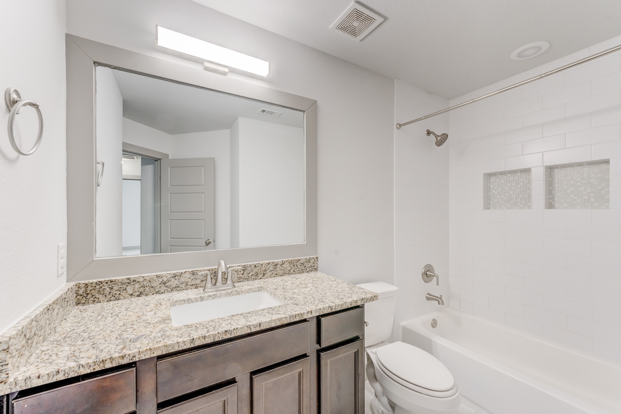 11913 Mockingbird Lane Montgomery, TX 77356 - Photo 10 of 19 a bathroom with a granite countertop sink toilet and shower