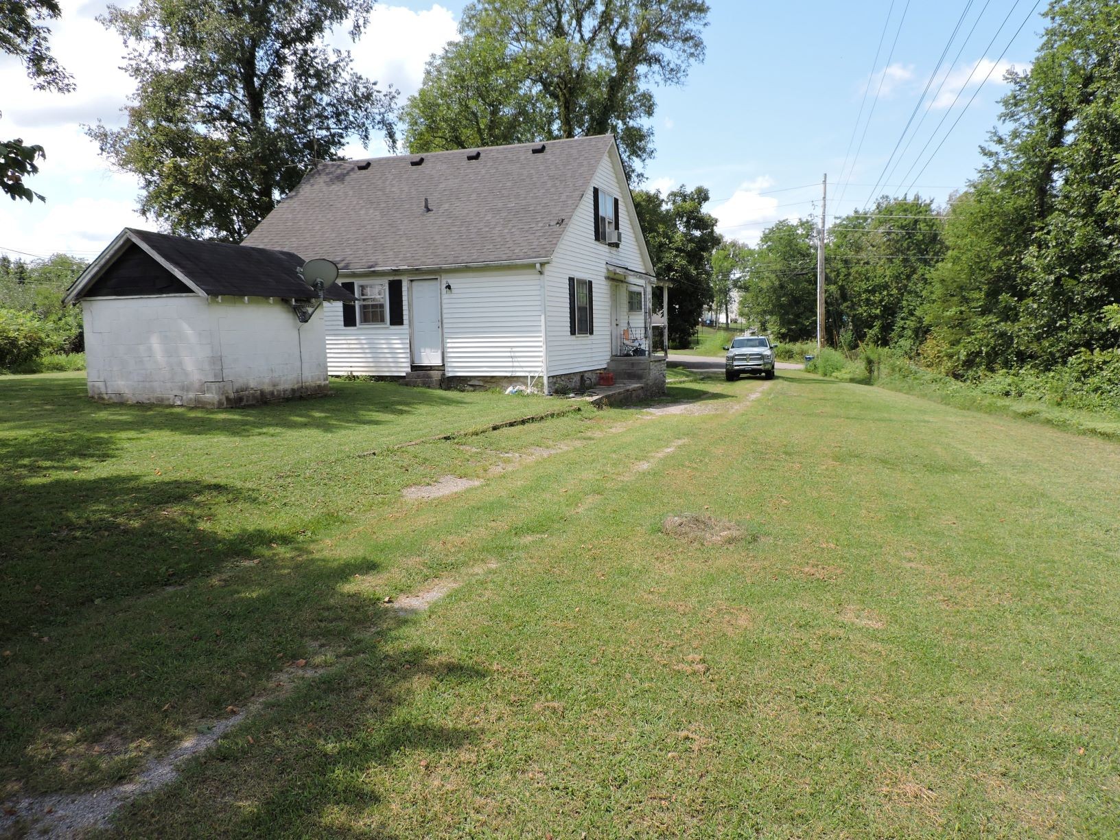 10891 Murfreesboro Road Lebanon, TN 37090 - Photo 11 of 16 a view of a house with a yard