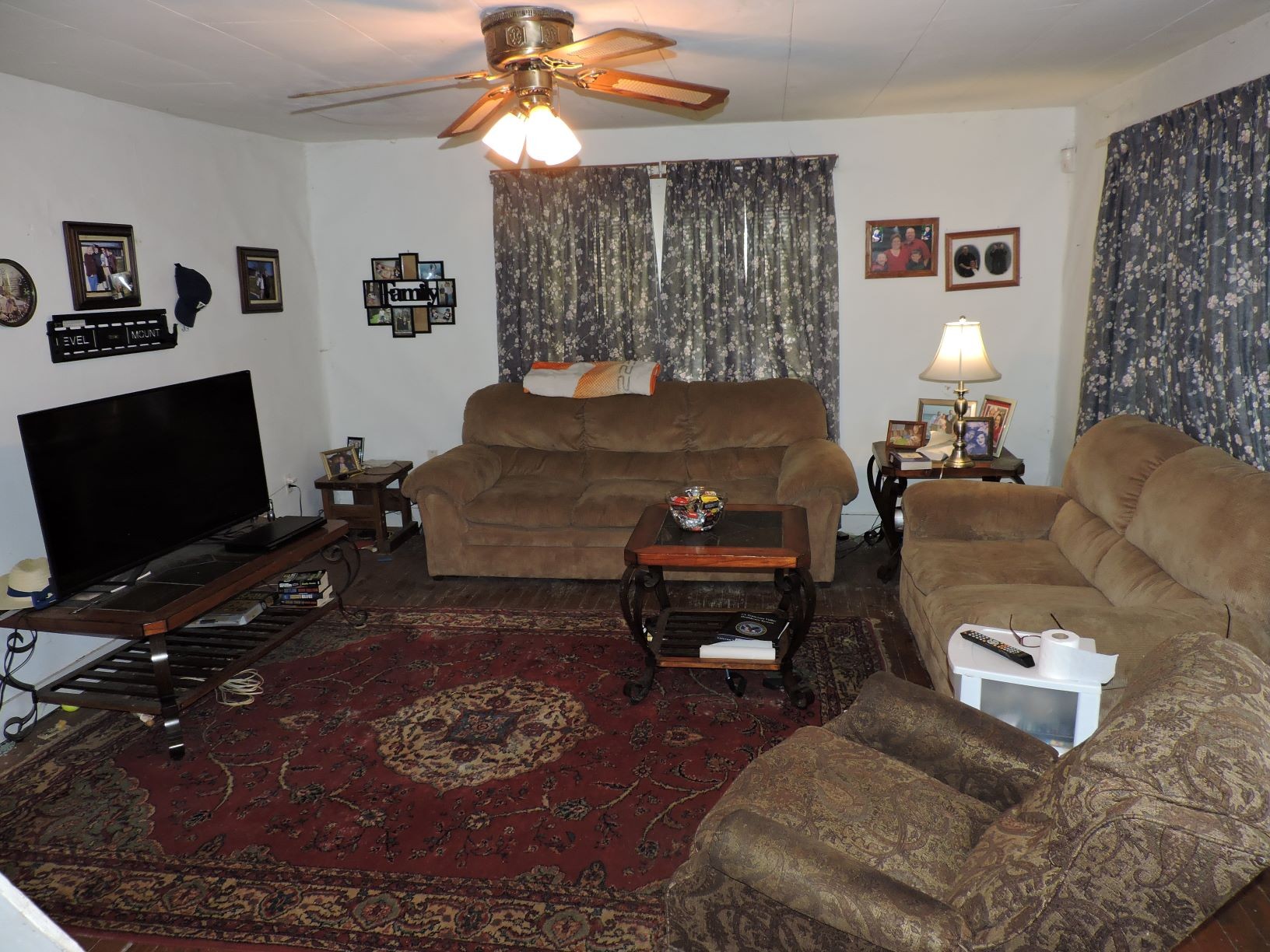10891 Murfreesboro Road Lebanon, TN 37090 - Photo 12 of 16 a living room with furniture a lamp and a flat screen tv