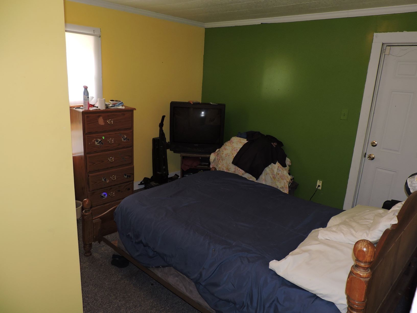 10891 Murfreesboro Road Lebanon, TN 37090 - Photo 14 of 16 a bedroom with a bed and a dresser