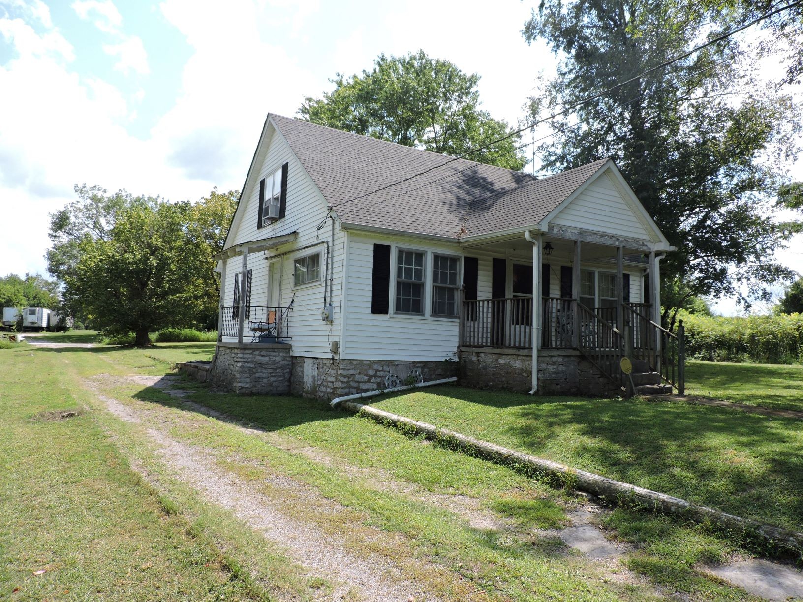 10891 Murfreesboro Road Lebanon, TN 37090 - Photo 2 of 16 a view of a house with a yard and large tree