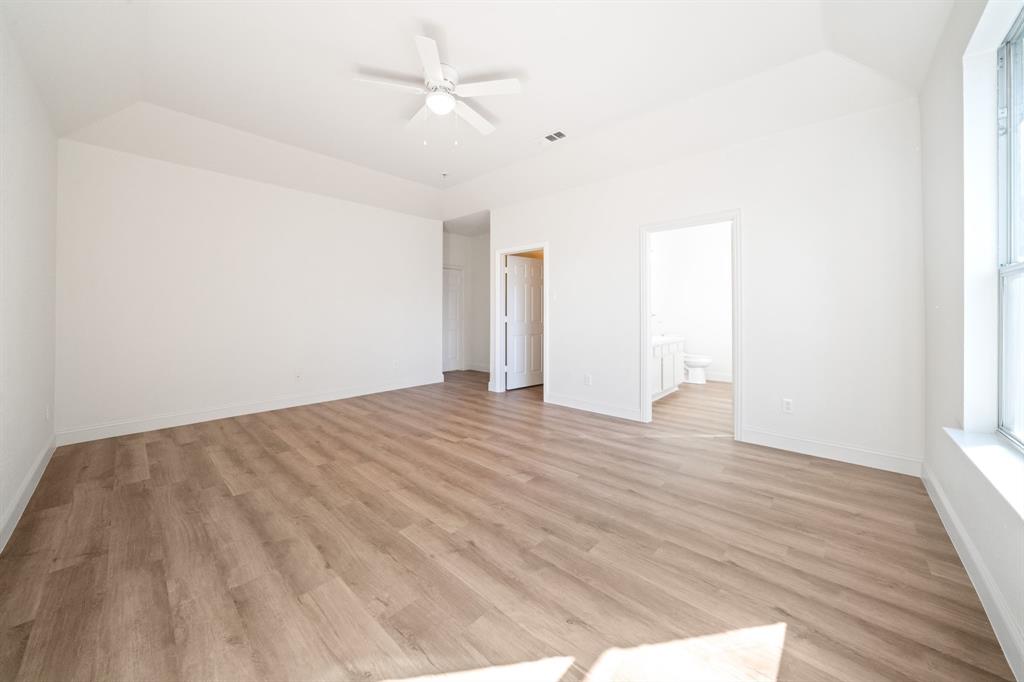 908 West Wintergreen Road Lancaster, TX 75134 - Photo 22 of 38 a view of empty room with wooden floor