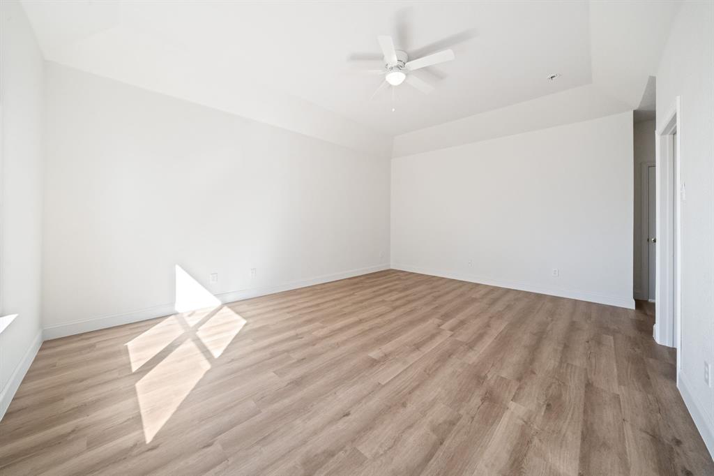 908 West Wintergreen Road Lancaster, TX 75134 - Photo 24 of 38 a view of empty room with wooden floor