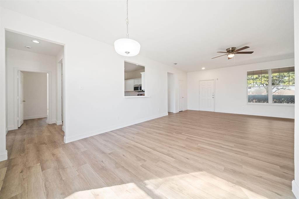 908 West Wintergreen Road Lancaster, TX 75134 - Photo 7 of 38 a view of an empty room with a window