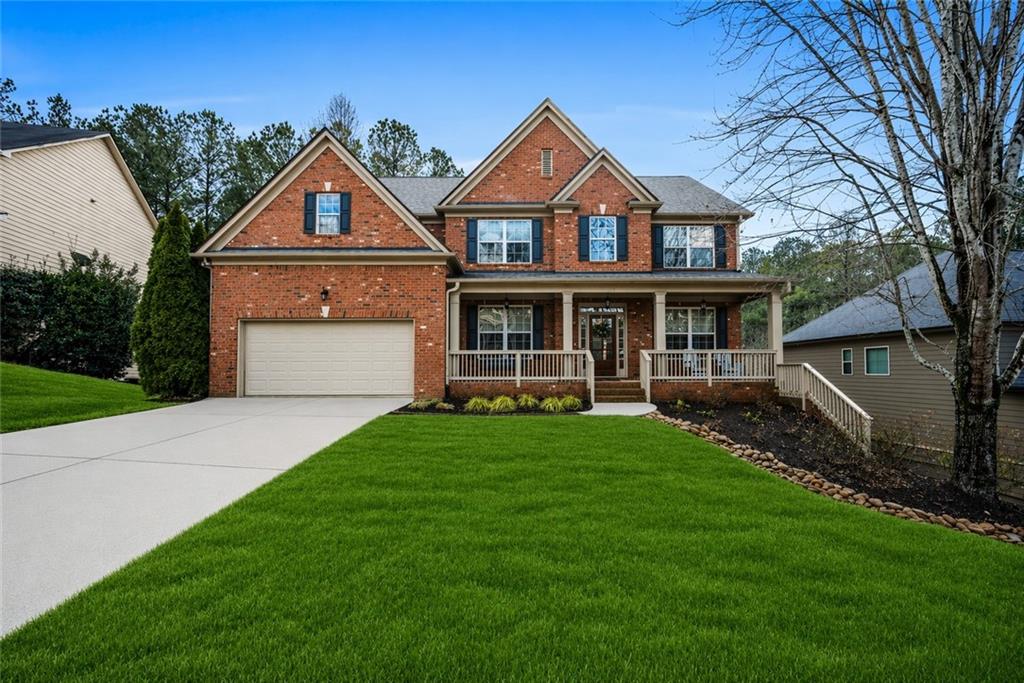 a front view of a house with a yard