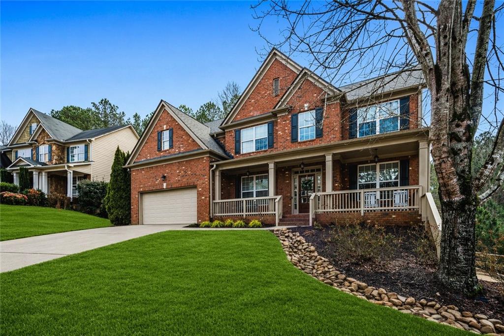 1122 Flagstone Way Acworth, GA 30101 - Photo 2 of 49 a front view of a house with a yard