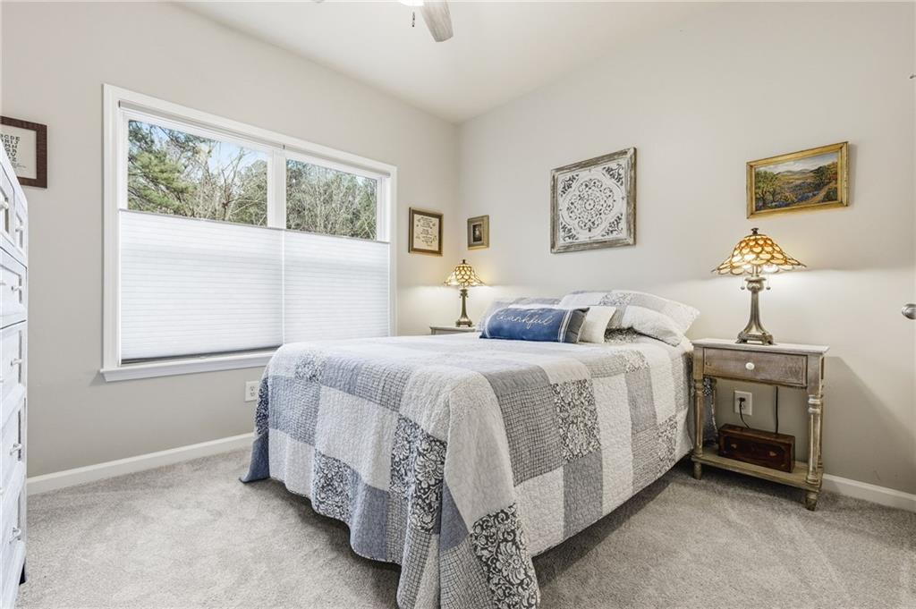 1122 Flagstone Way Acworth, GA 30101 - Photo 24 of 50 a bedroom with a bed and a window