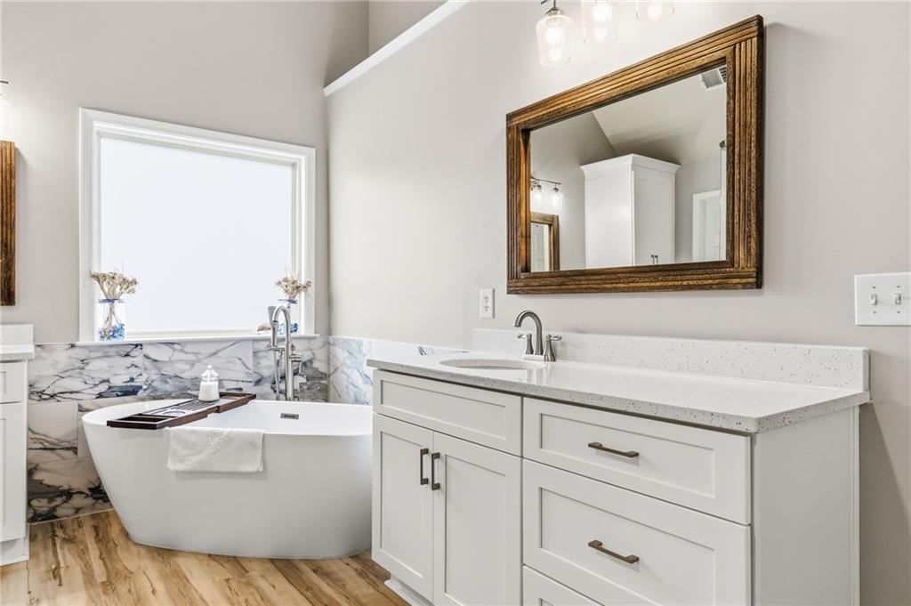 1122 Flagstone Way Acworth, GA 30101 - Photo 29 of 50 a bathroom with a sink and a mirror