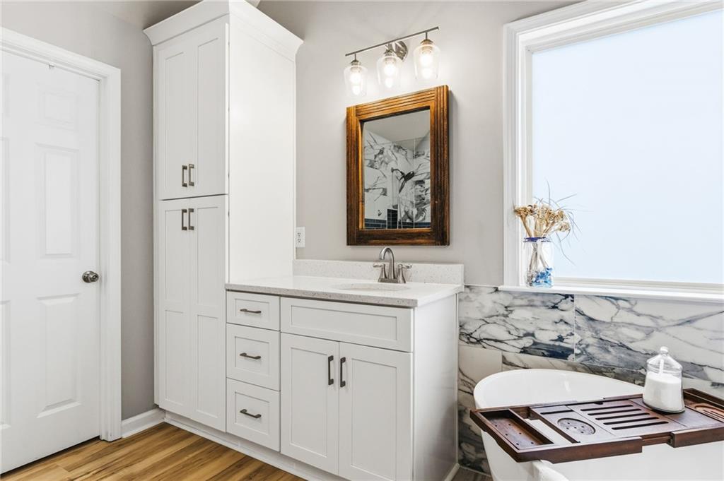 1122 Flagstone Way Acworth, GA 30101 - Photo 30 of 50 a bathroom with a sink and a window