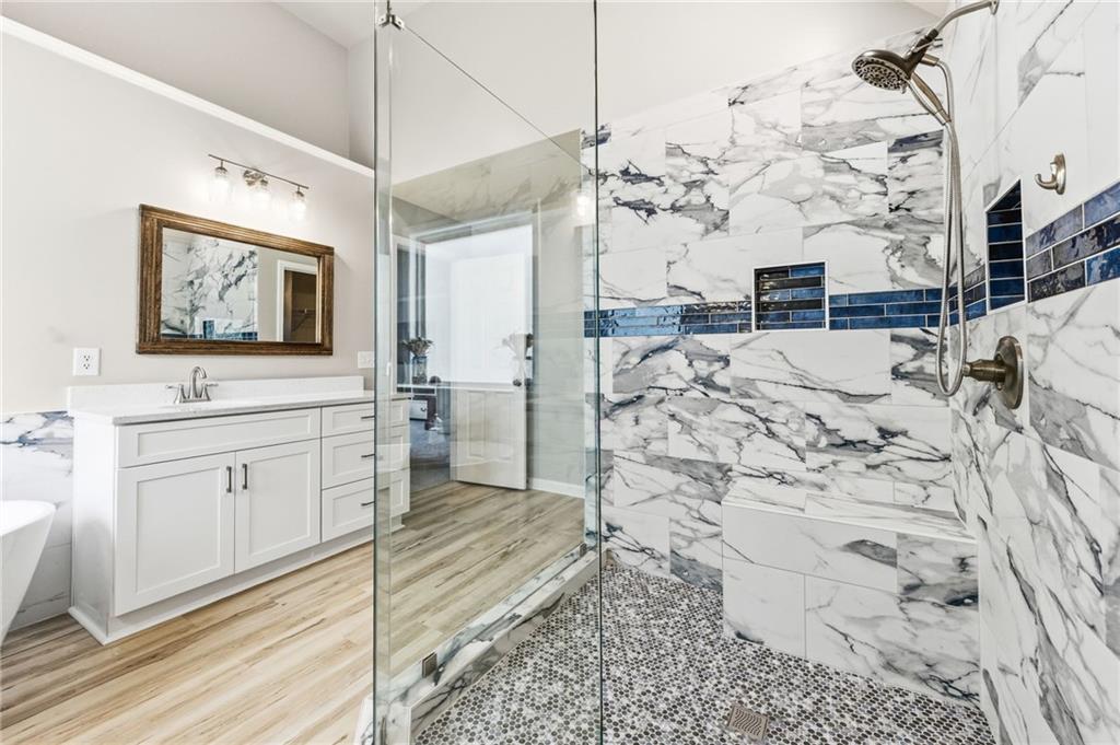 1122 Flagstone Way Acworth, GA 30101 - Photo 31 of 50 a bathroom with a sink mirror and vanity