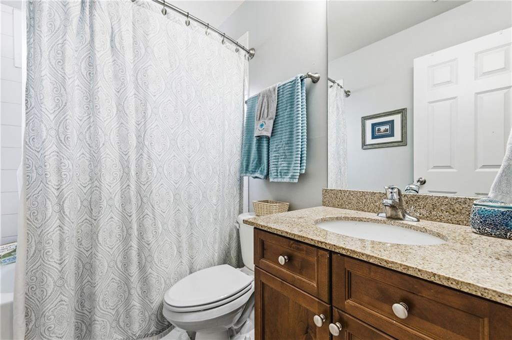 1122 Flagstone Way Acworth, GA 30101 - Photo 35 of 50 a bathroom with a granite countertop sink and a mirror