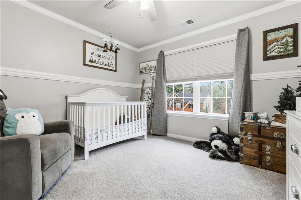 1122 Flagstone Way Acworth, GA 30101 - Photo 36 of 50 a bedroom with furniture and a large window