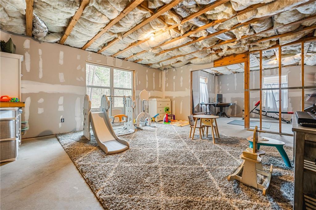 1122 Flagstone Way Acworth, GA 30101 - Photo 39 of 50 a view of a room with gym equipment