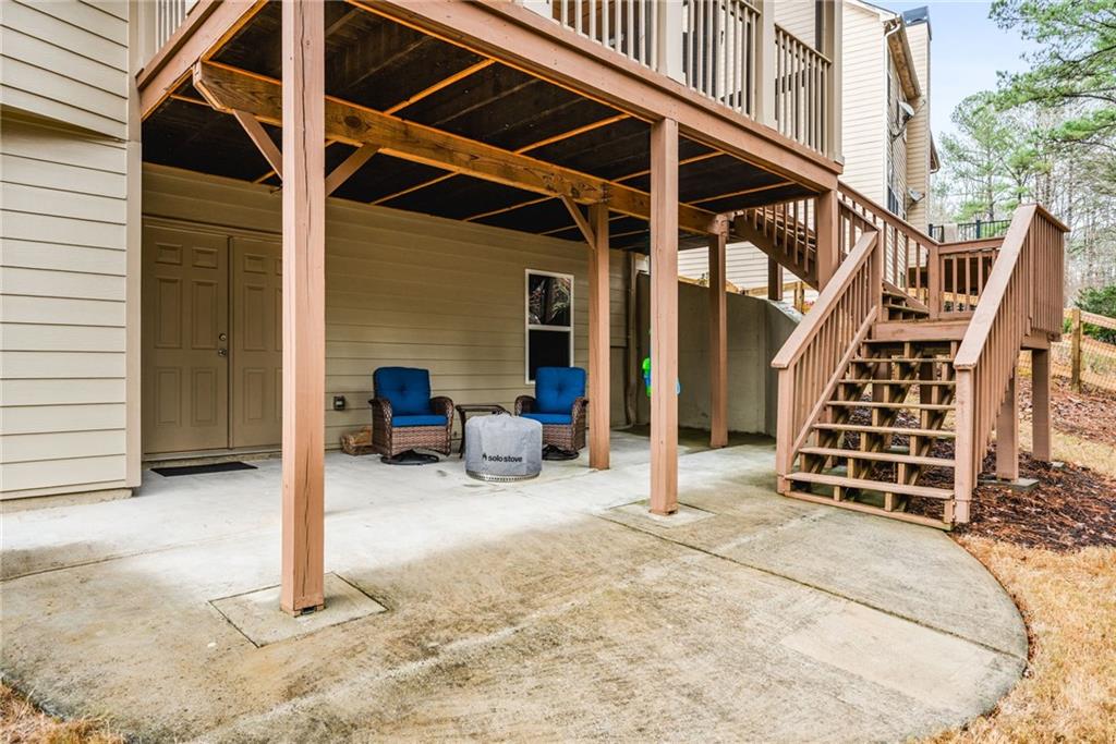 1122 Flagstone Way Acworth, GA 30101 - Photo 44 of 50 a view of a chair and tables in the house