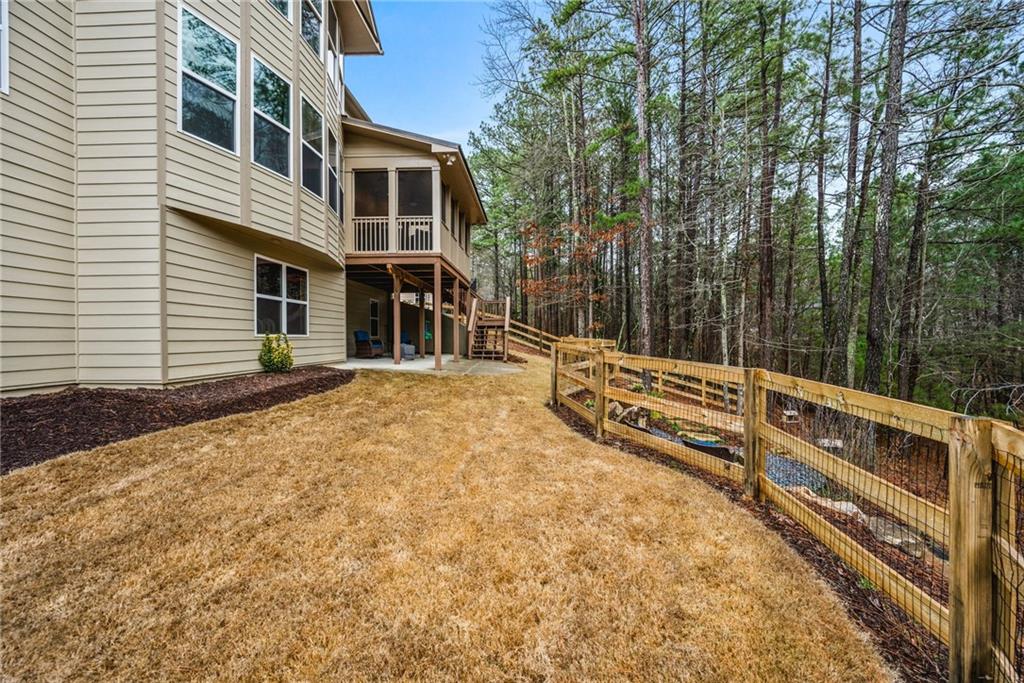 1122 Flagstone Way Acworth, GA 30101 - Photo 48 of 49 a view of a house with a wooden fence