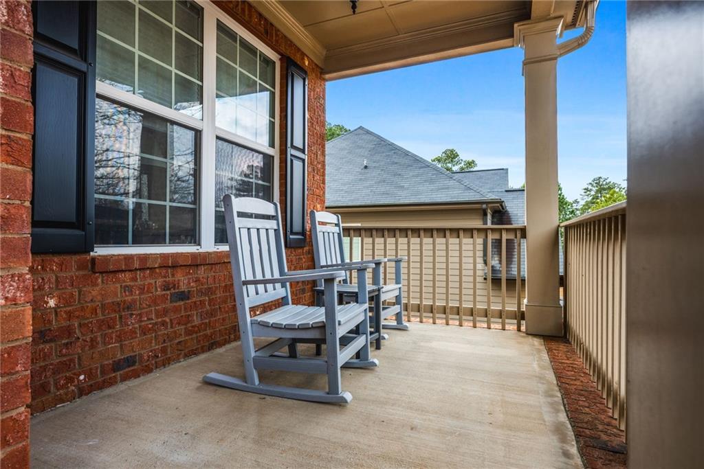 1122 Flagstone Way Acworth, GA 30101 - Photo 5 of 50 a balcony with table and chairs