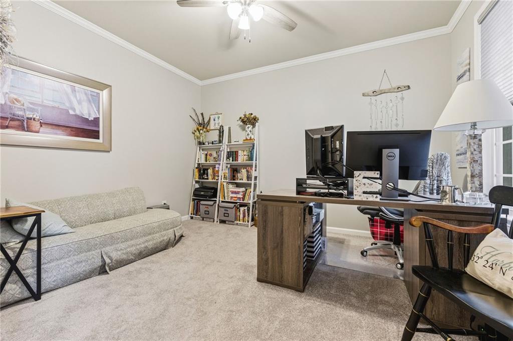 1122 Flagstone Way Acworth, GA 30101 - Photo 7 of 50 a living room with furniture and a flat screen tv