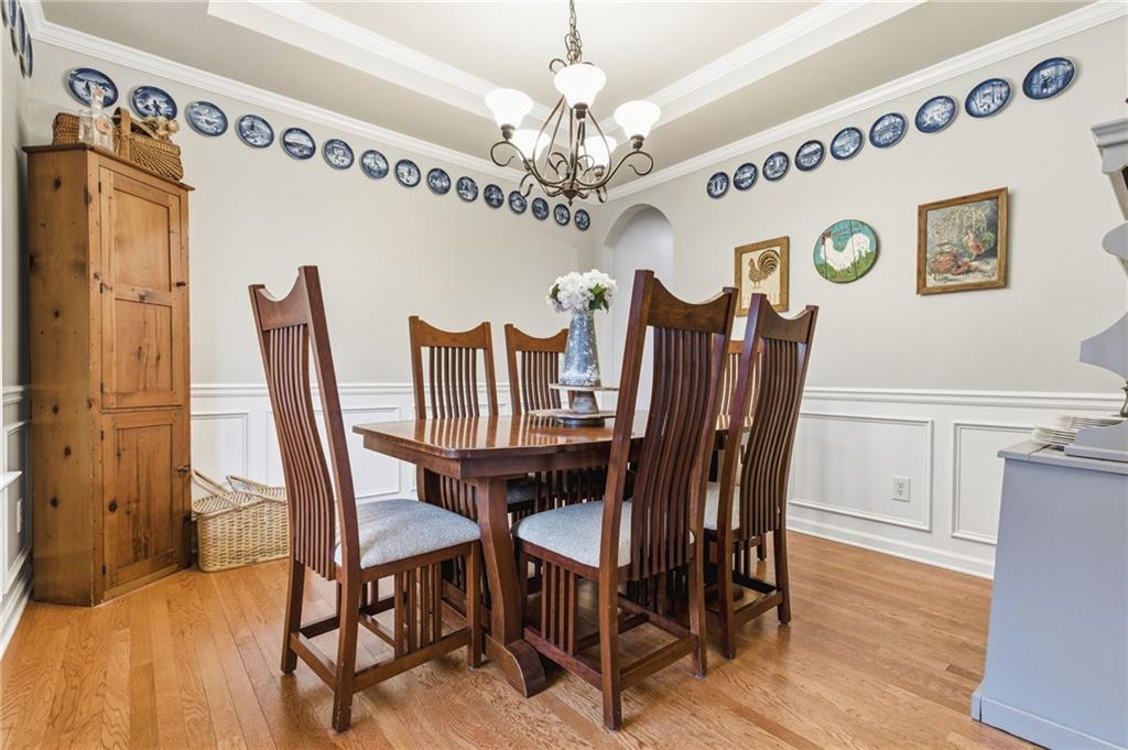 1122 Flagstone Way Acworth, GA 30101 - Photo 8 of 49 a view of a dining room with furniture and chandelier