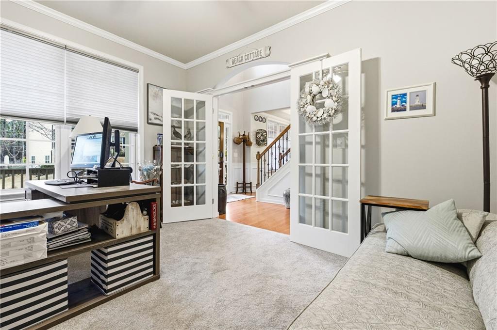1122 Flagstone Way Acworth, GA 30101 - Photo 8 of 50 a living room with furniture and a book shelf