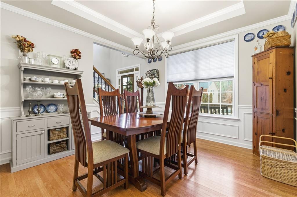 1122 Flagstone Way Acworth, GA 30101 - Photo 10 of 50 a view of a dining room with furniture window and wooden floor
