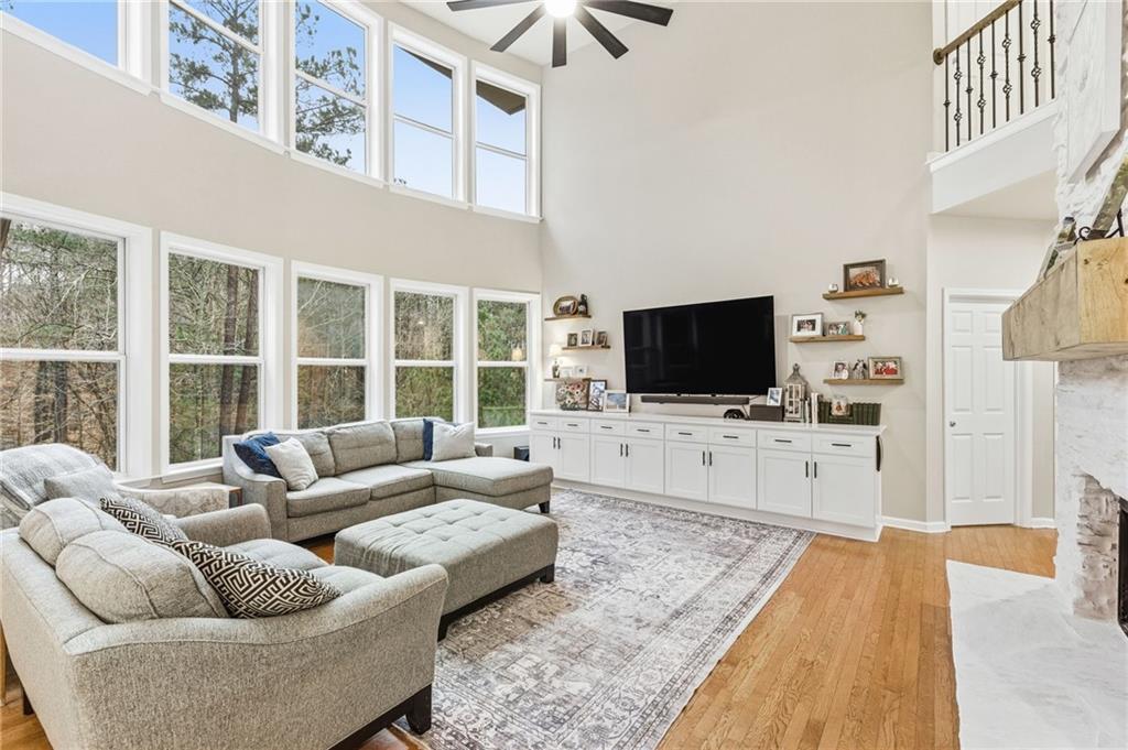 1122 Flagstone Way Acworth, GA 30101 - Photo 10 of 49 a living room with furniture and a flat screen tv
