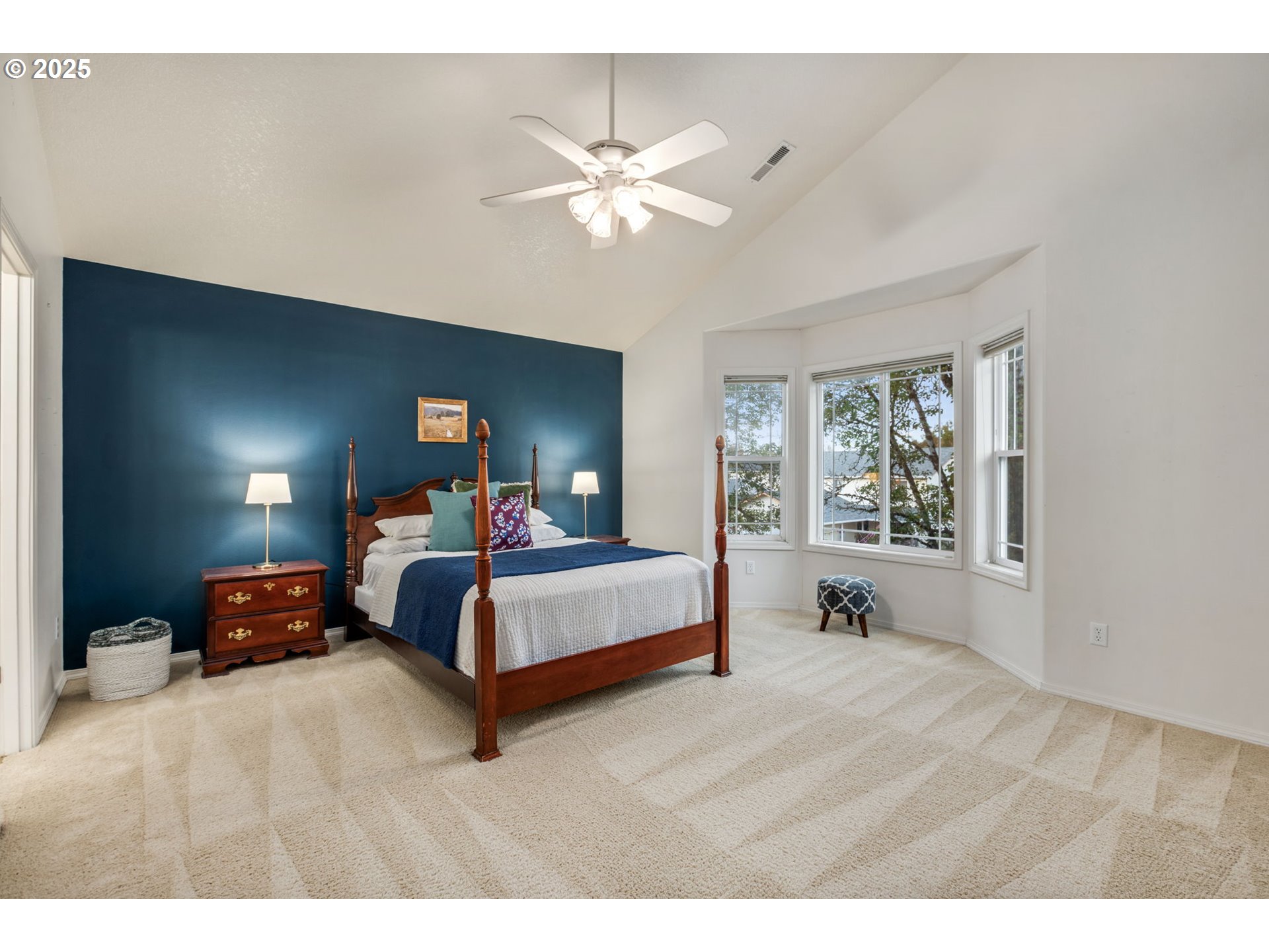 16525 Northeast 20th Street Vancouver, WA 98684 - Photo 11 of 33 a bedroom with a bed and a chandelier