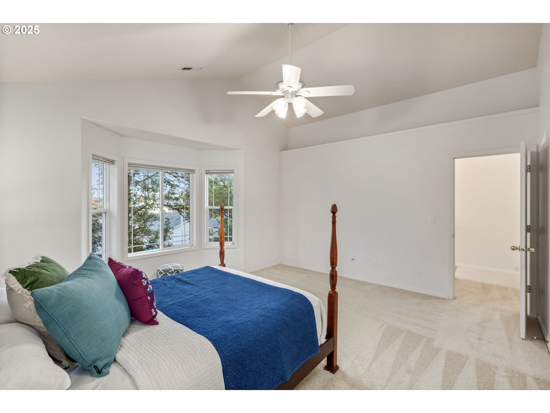 16525 Northeast 20th Street Vancouver, WA 98684 - Photo 12 of 33 a bedroom with a bed and a chandelier