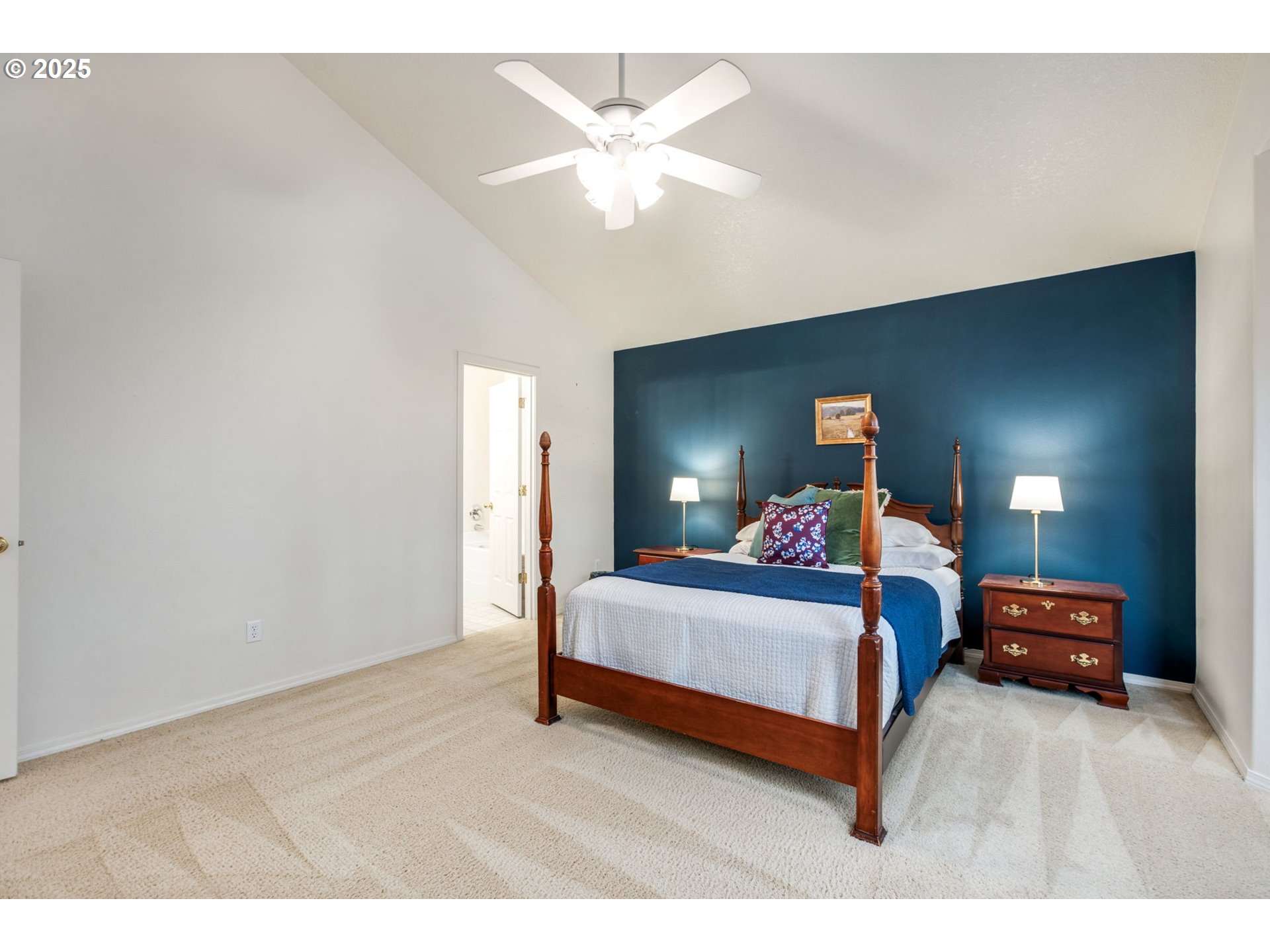 16525 Northeast 20th Street Vancouver, WA 98684 - Photo 13 of 33 a bedroom with bed and a chandelier