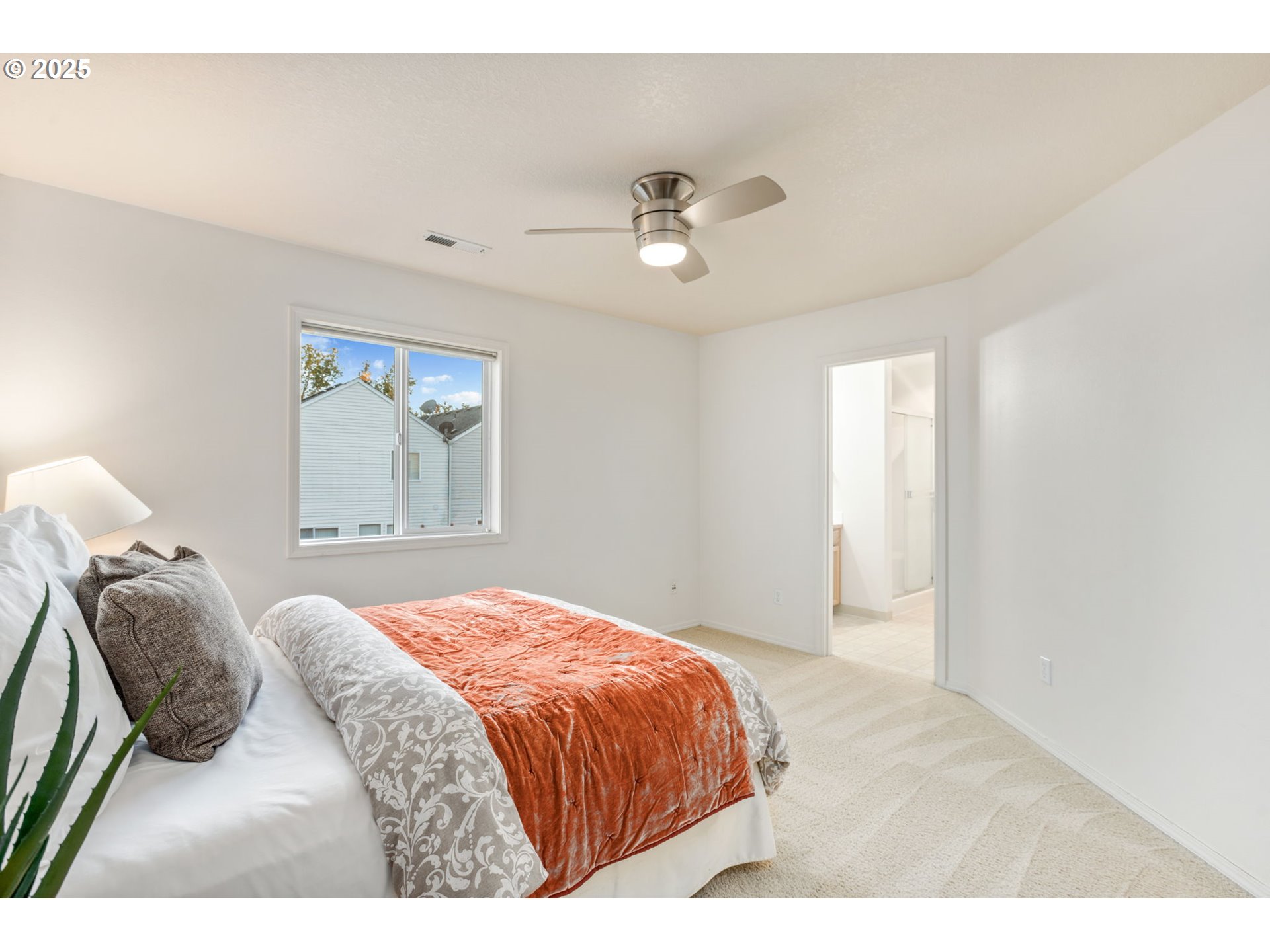 16525 Northeast 20th Street Vancouver, WA 98684 - Photo 16 of 33 a bedroom with a large bed and a window