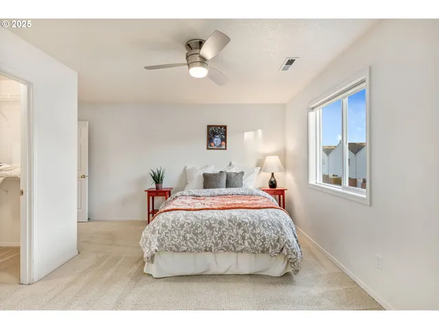 a bedroom with a bed and window