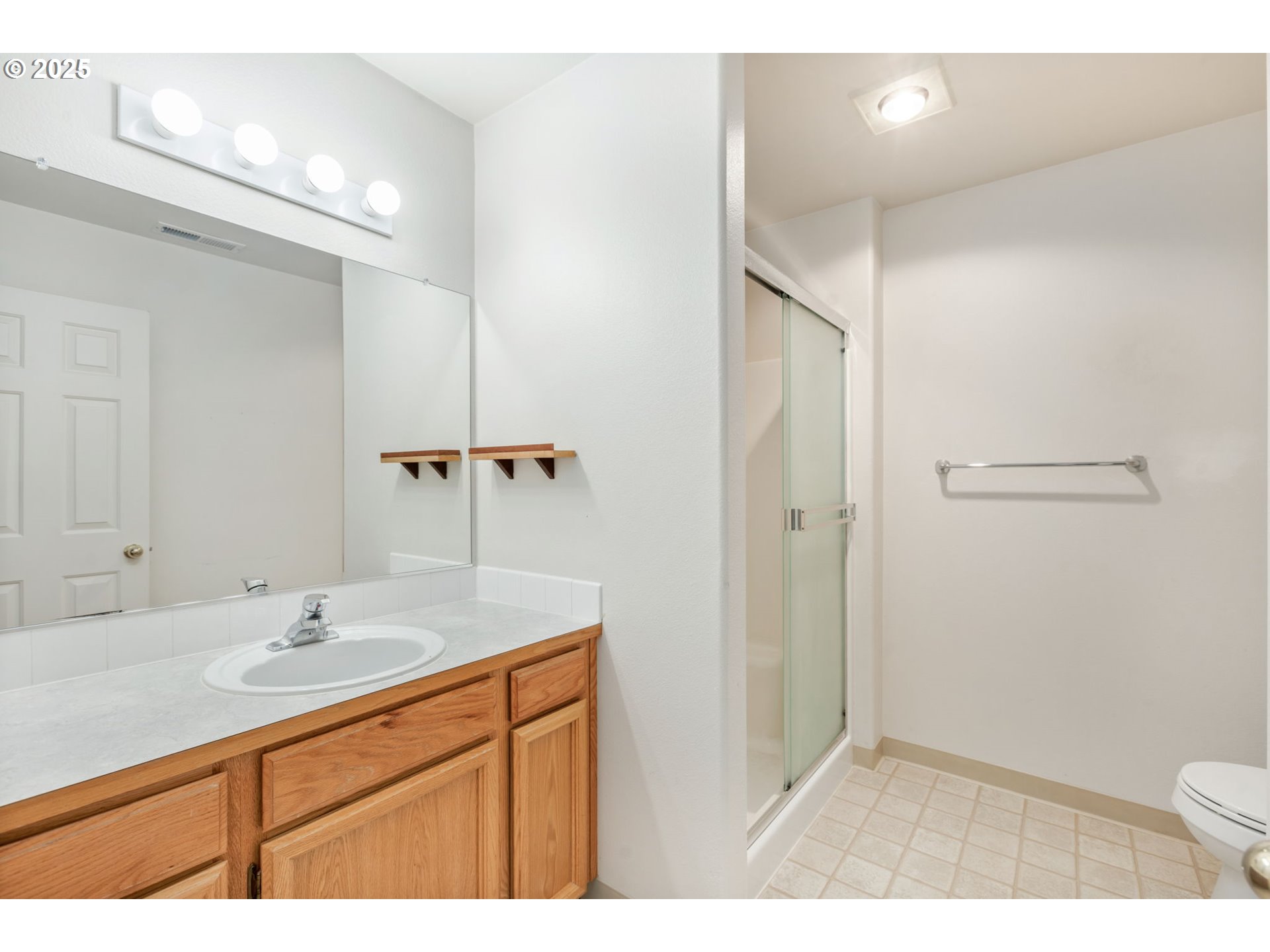 16525 Northeast 20th Street Vancouver, WA 98684 - Photo 18 of 33 a bathroom with a sink a toilet and shower