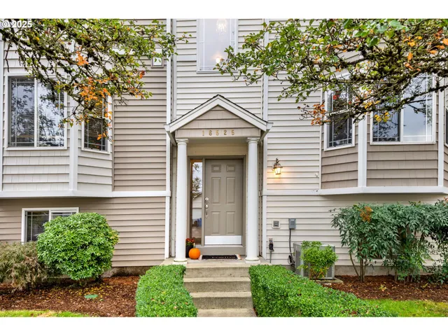 a view of a house with a yard and plants