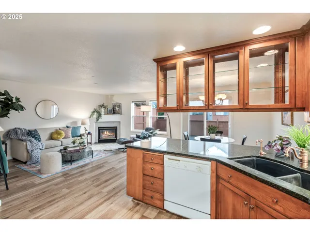 a kitchen with a table chairs stove and cabinets